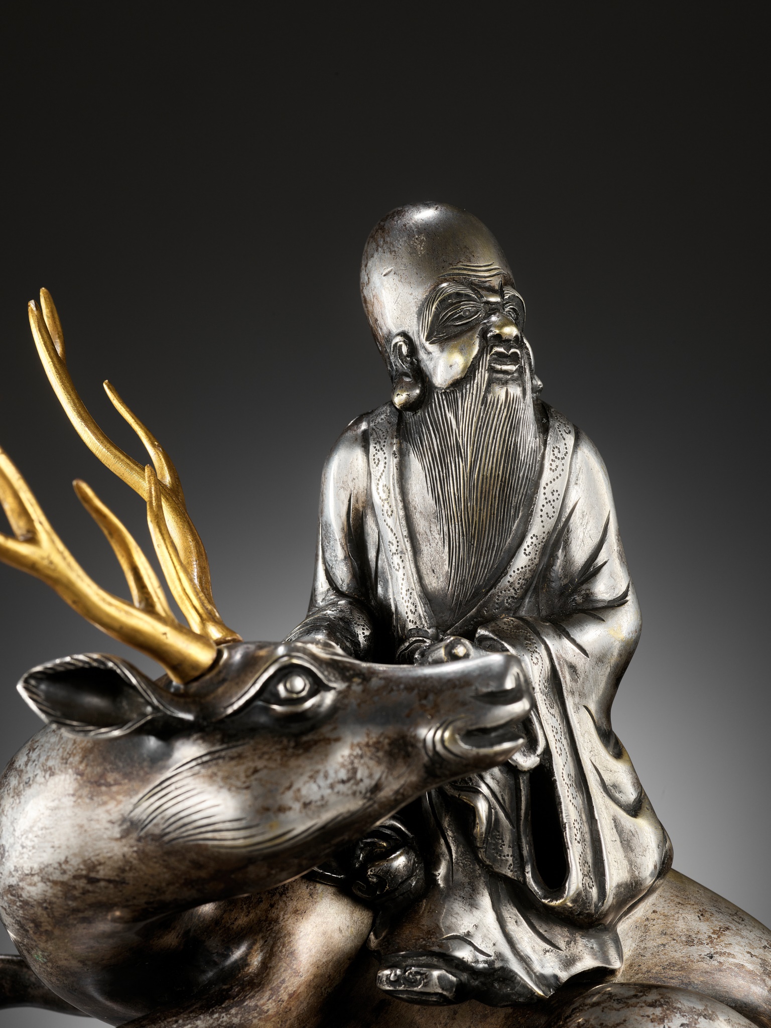 A SILVERED AND GILT BRONZE 'SHOULAO AND DEER' INCENSE BURNER, QING DYNASTY - Image 3 of 14