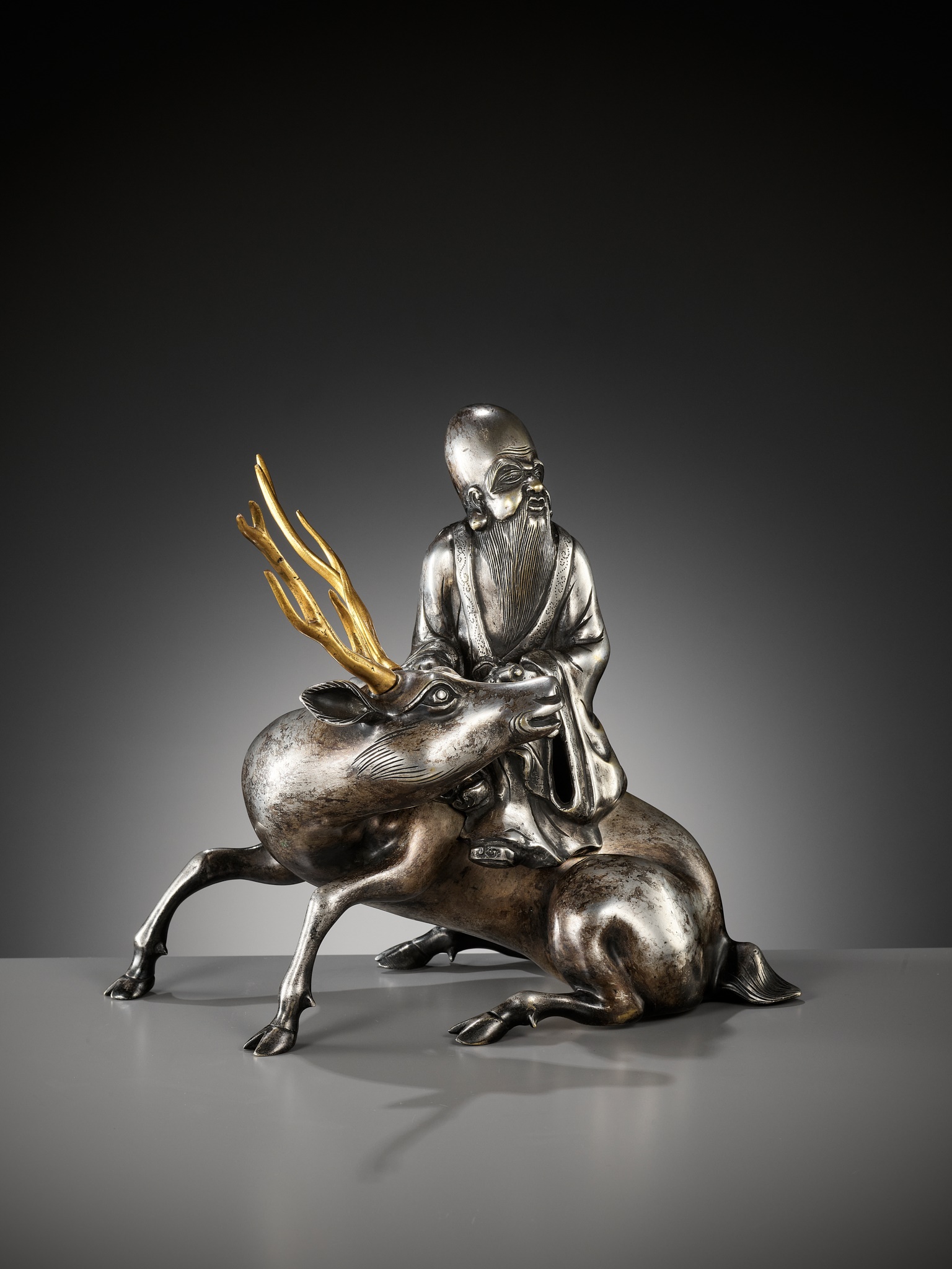 A SILVERED AND GILT BRONZE 'SHOULAO AND DEER' INCENSE BURNER, QING DYNASTY - Image 10 of 14