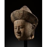 A LARGE SANDSTONE HEAD OF A MALE DEITY, ANGKOR PERIOD, KHLEANG STYLE