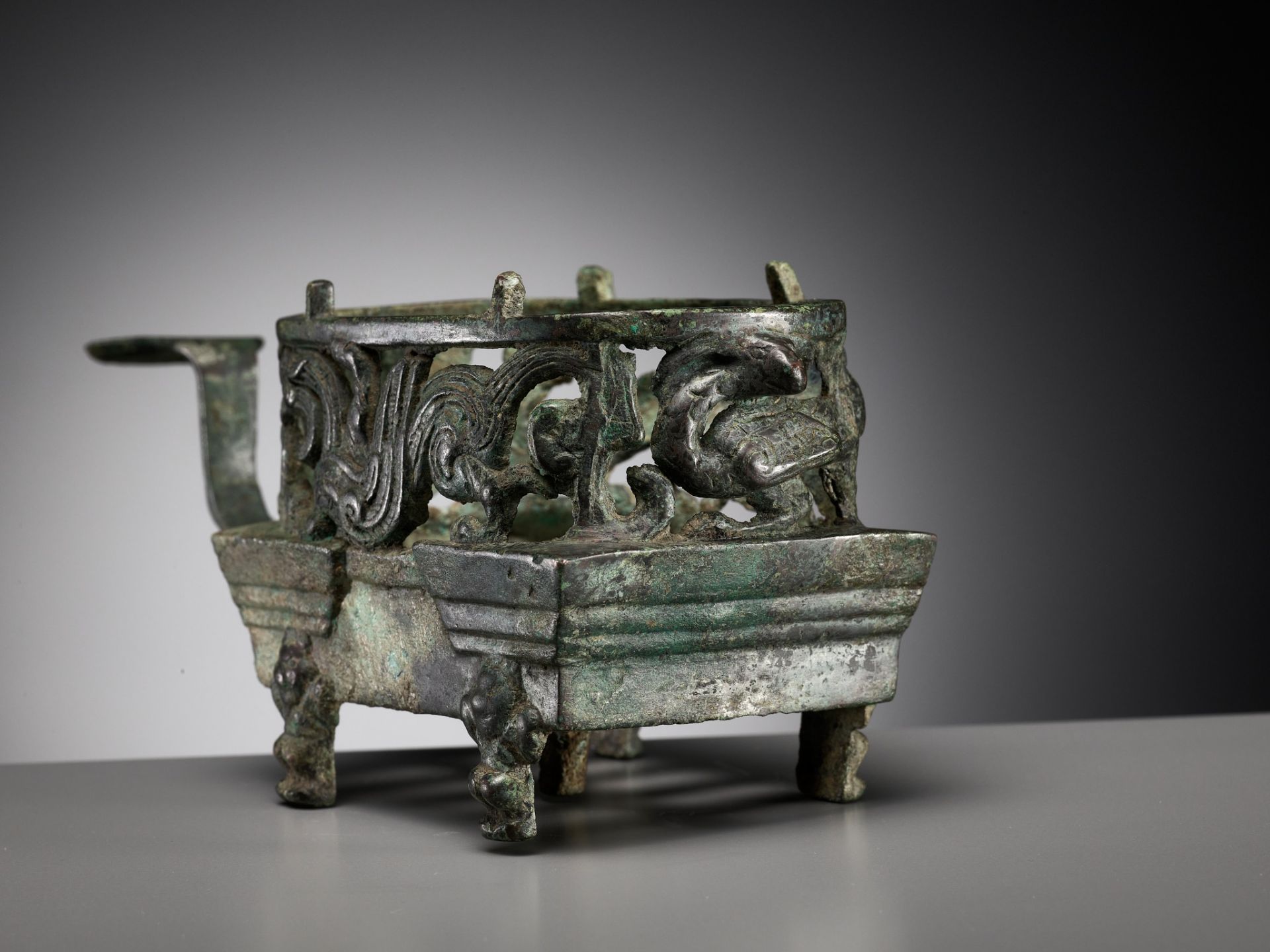 A 'FOUR AUSPICIOUS BEASTS' (SI XIANG) BRONZE BRAZIER, HAN DYNASTY, CHINA, 206 BC-220 AD - Image 3 of 16
