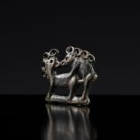 AN ORDOS BRONZE 'COPULATING STAGS' PLAQUE, EASTERN ZHOU
