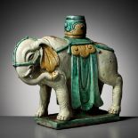 A SANCAI-GLAZED 'ELEPHANT' CANDLEHOLDER, MING DYNASTY