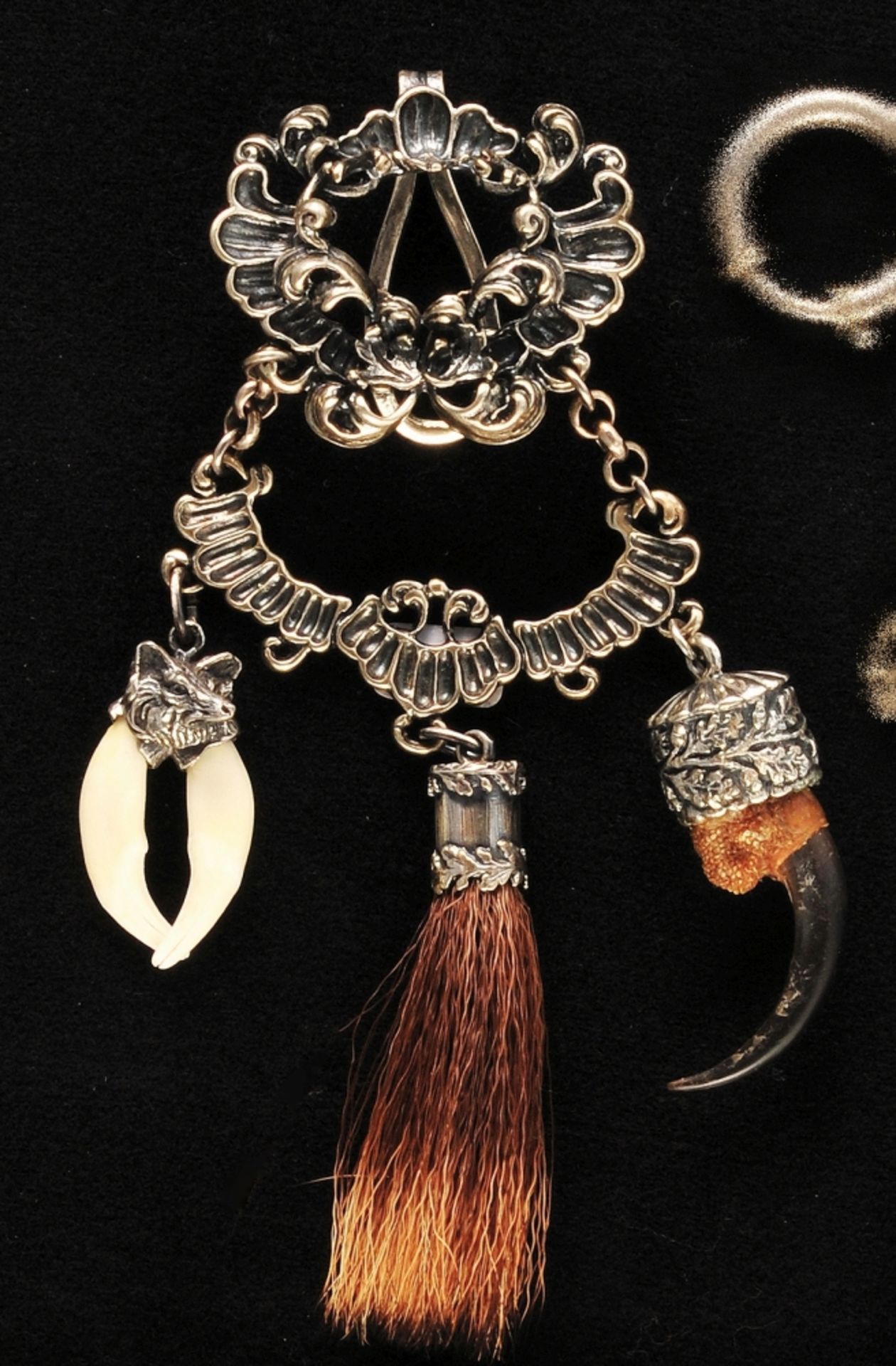 Silver jewelry chatelaine, richly decorated, with various pendants