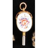 Gold enamel pocket watch key, both sides with oval enamel medallions with colorful floral decor,