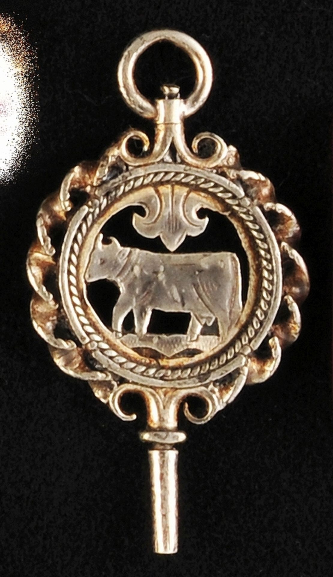 Pocket watch key, silver plated, relief and cut out with depiction of a cow