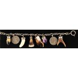 Charivari silver necklace with various pendants in ornate settings, 