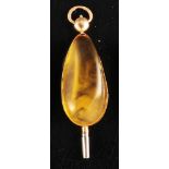 Pocket watch key, 14 ct. gold setting with oval amber