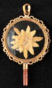 Pocket watch key, round, decorated, gilded frame