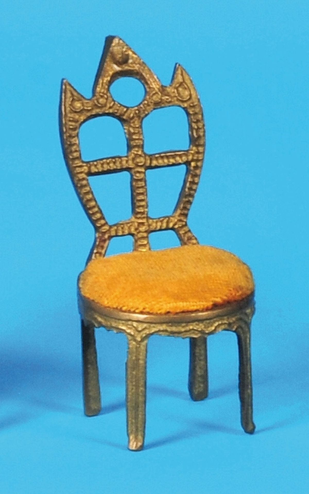 Small pocket watch stand in the shape of a chair, gilded structure with yellow velvet seating surfac