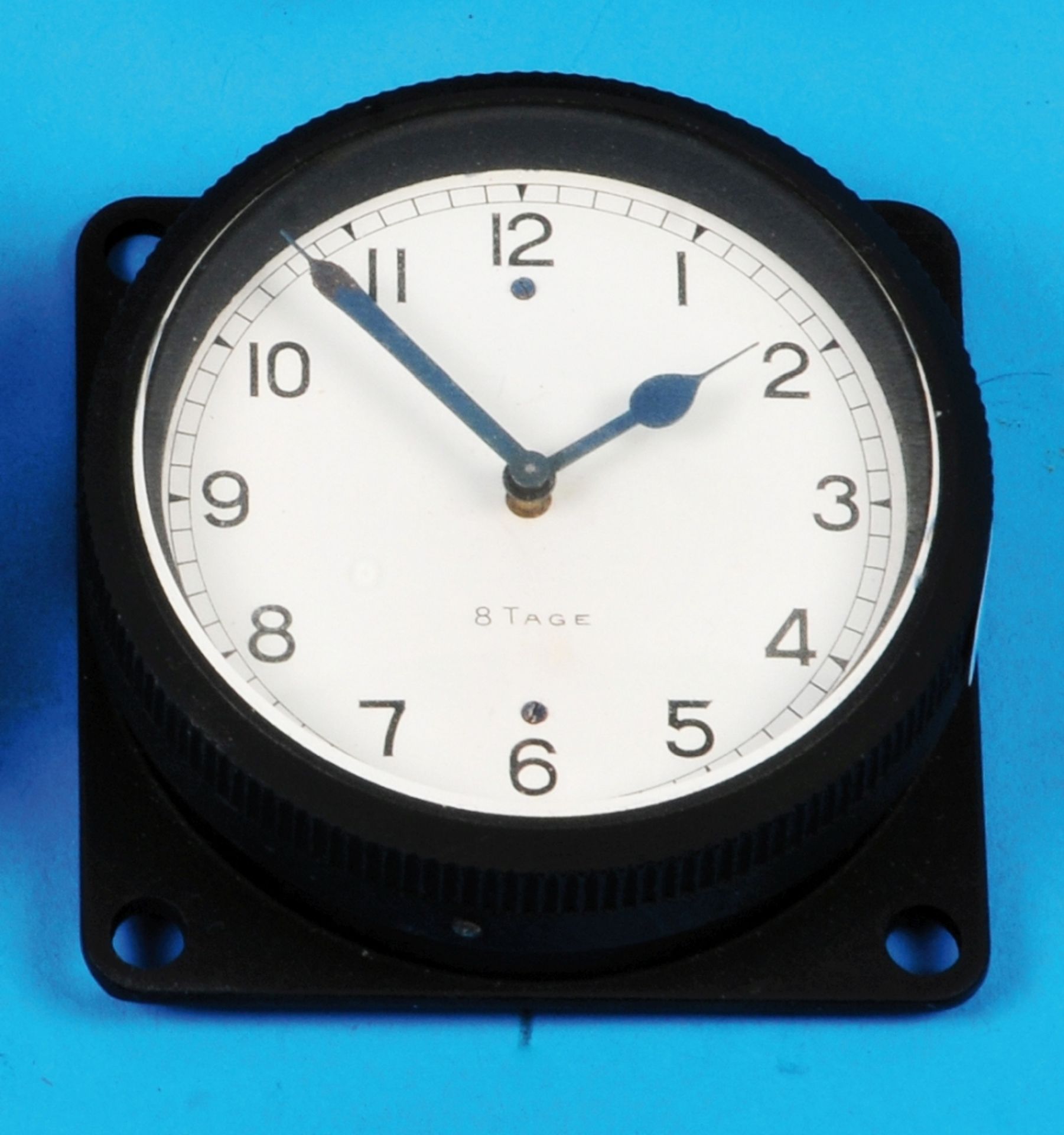 Onboard clock with 8-day movement, black case, white dial with Arabic numerals, 