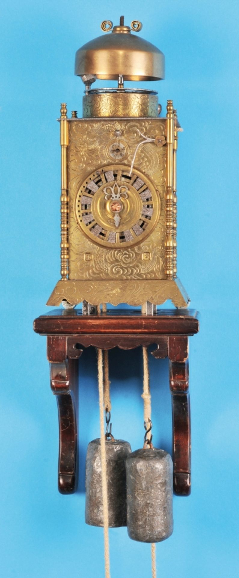 Japanese lantern clock on wooden console with wheel detent and striking mechanism,  