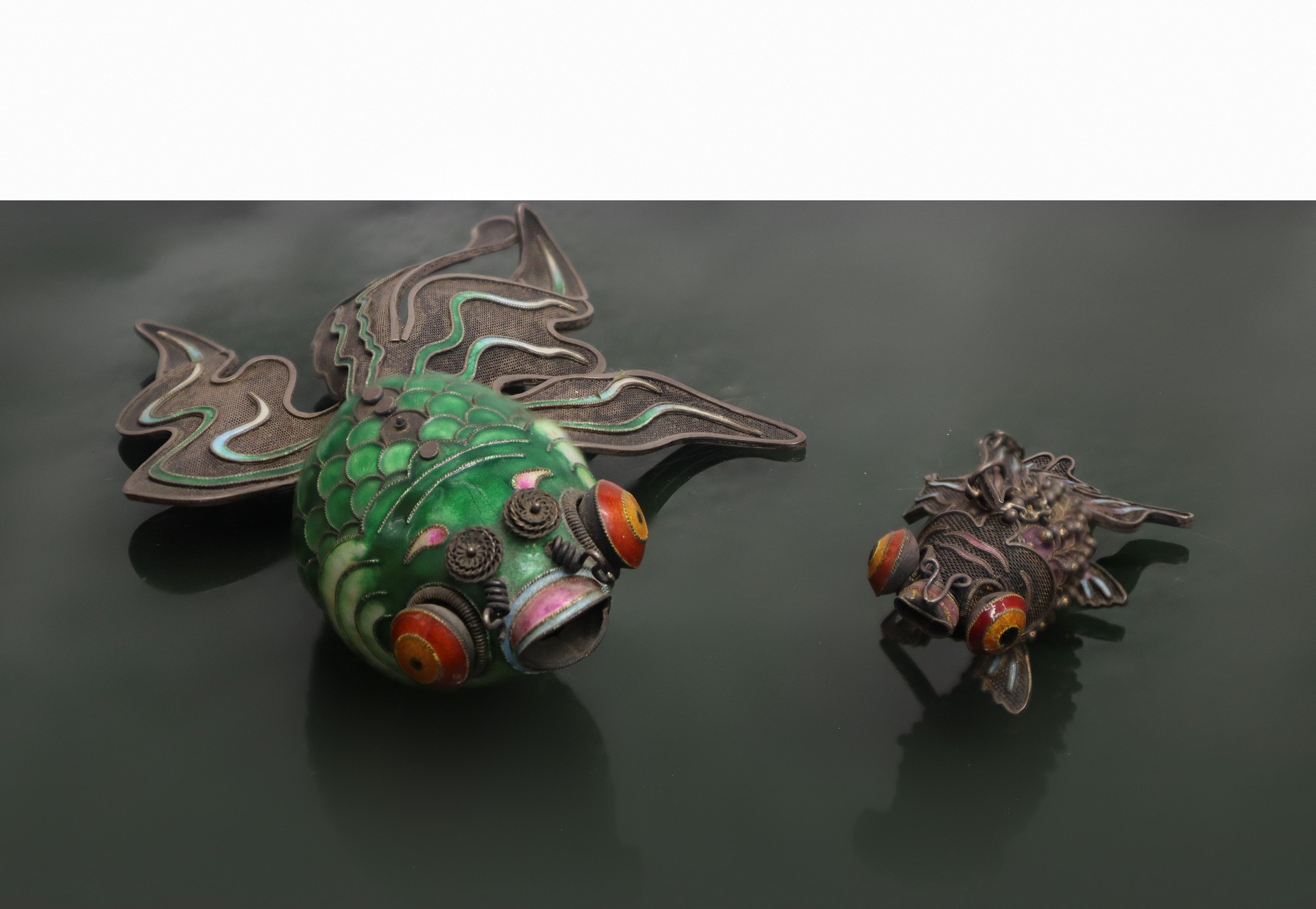 Tropical fish in cloisonné enamels and tropical fish in metal with articulated bodies, China, 20th c