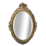 Oval mirror in gilded wood, Late 19th century