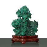 Malachite statue depicting warrior on pho dog