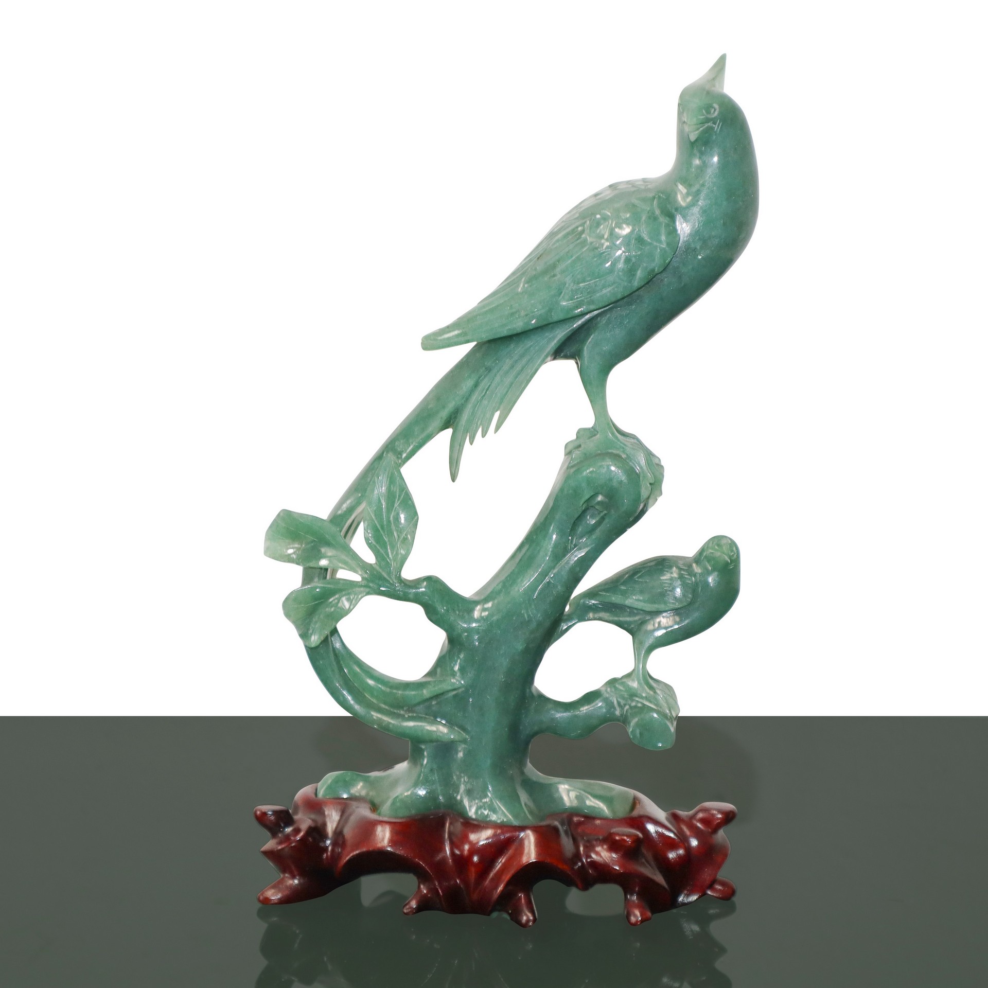 Jade sculpture depicting birds on a branch