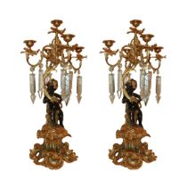 Pair of 5-light candelabra with black patinated cherubs supporting them, ground glass toasts., 20th