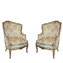 Ancient pair of bergeres, Louis XV. In finely carved and lacquered wood. Floral patterned wallpaper.