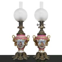 Pair of large oil lamps in pink Sevres porcelain with reserves on both sides with cherubs and floral