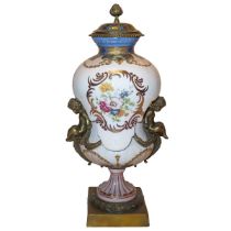 Poutiche vase in decorated and painted white porcelain, gilded bronze putti applied to the sides, 20