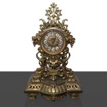 Gilded bronze table clock with cherubs and grape shoots.