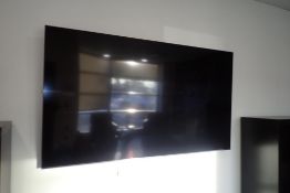 Samsung 75" Flatscreen Television w/Wall Mount and Feet- REMOTE AT OFFICE.