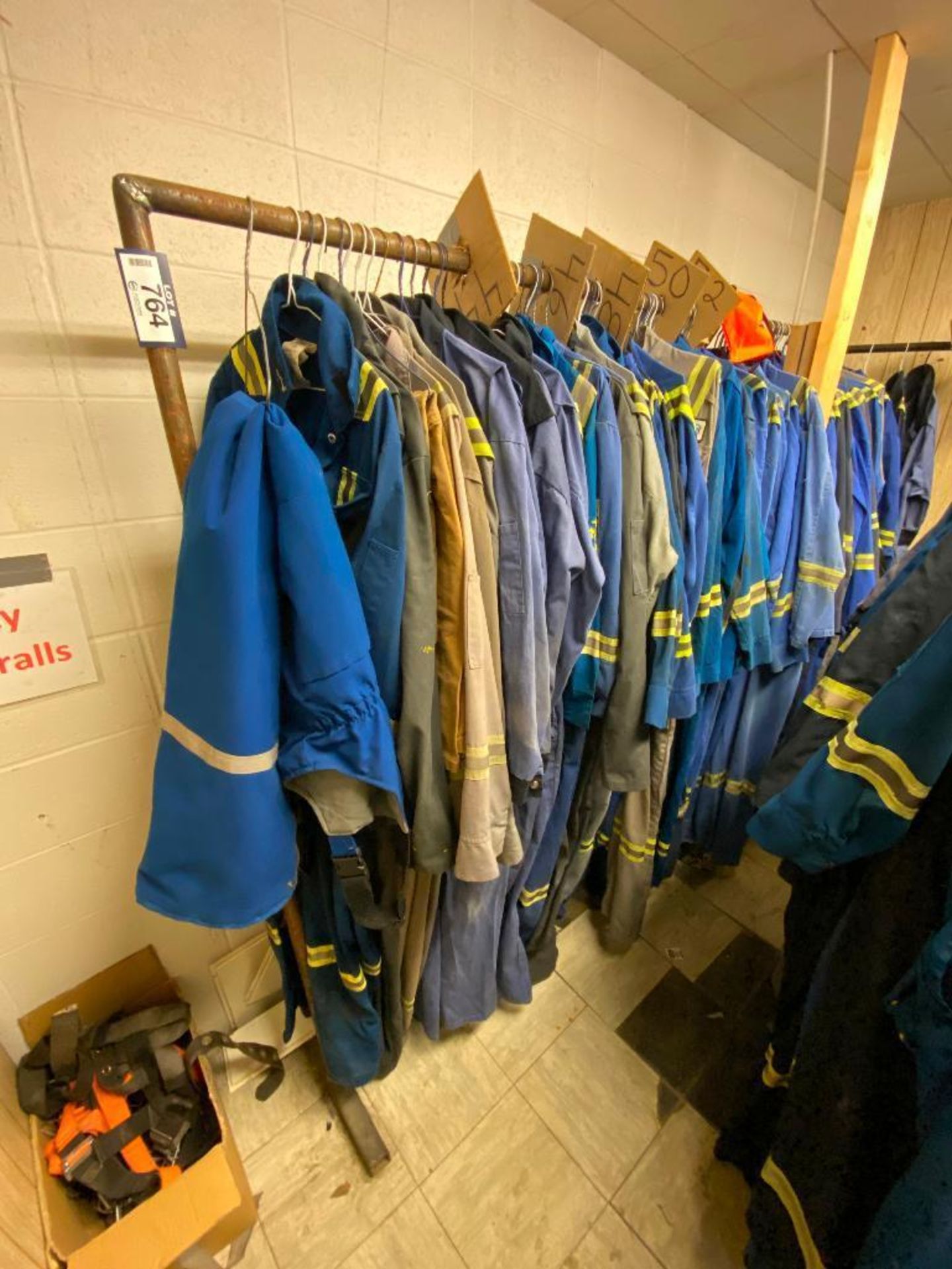 Lot of Asst. Coveralls w/ Rack (Sizes 44 - 52)