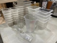 ASSORTED POLYCARB INSERTS & PLASTIC MEASURING PITCHERS