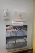 Lot of Asst. First Aid Supplies and Metal Wall Rack.