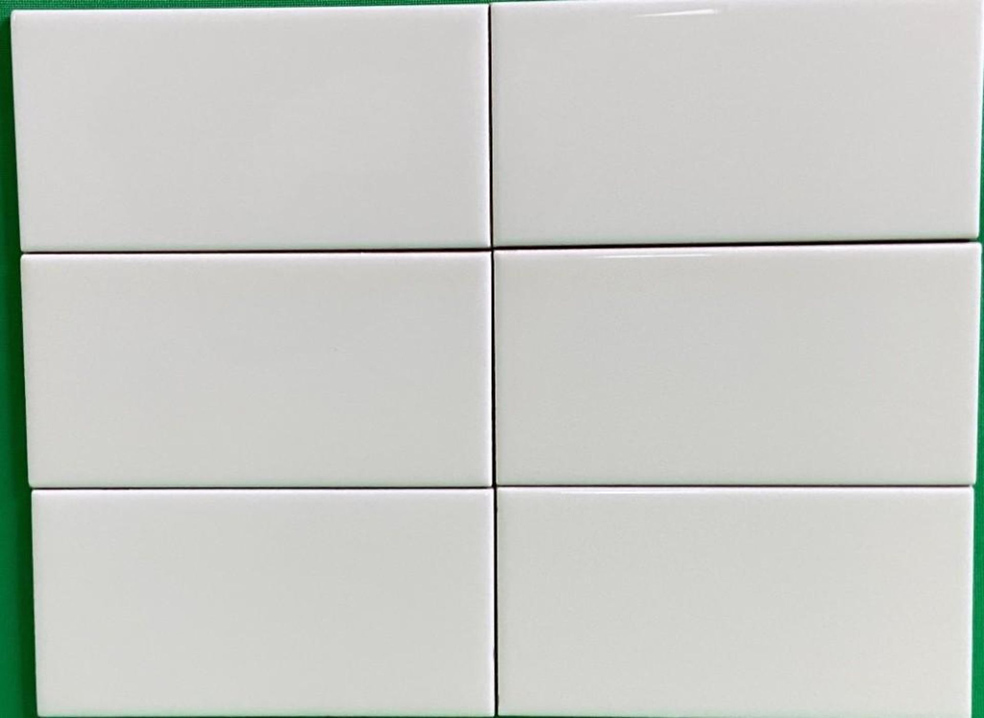 Lot of Approx. (58) Boxes-1,102sq ft Glossy Ivory 3x6 Ceramic Subway Wall Tile.