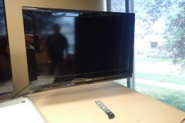 Toshiba 32" Flatscreen Television w/Wall Mount- REMOTE AT AUCTION OFFICE.