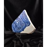 A RARE CHINESE BLUE AND WHITE PORCELAIN SHARD, EARLY MING DYNASTY, 15TH CENTURY