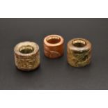 A GROUP OF THREE CHINESE CARVED JADE ARCHERS THUMB RINGS, QING DYNASTY