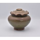 A CHINESE CELADON-GLAZED JAR AND COVER, YUAN/MING DYNASTY