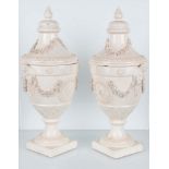 Coppia di vasi in terraglia di stile neoclassico composto da erme e festoni fioriti. Manifattura "Co