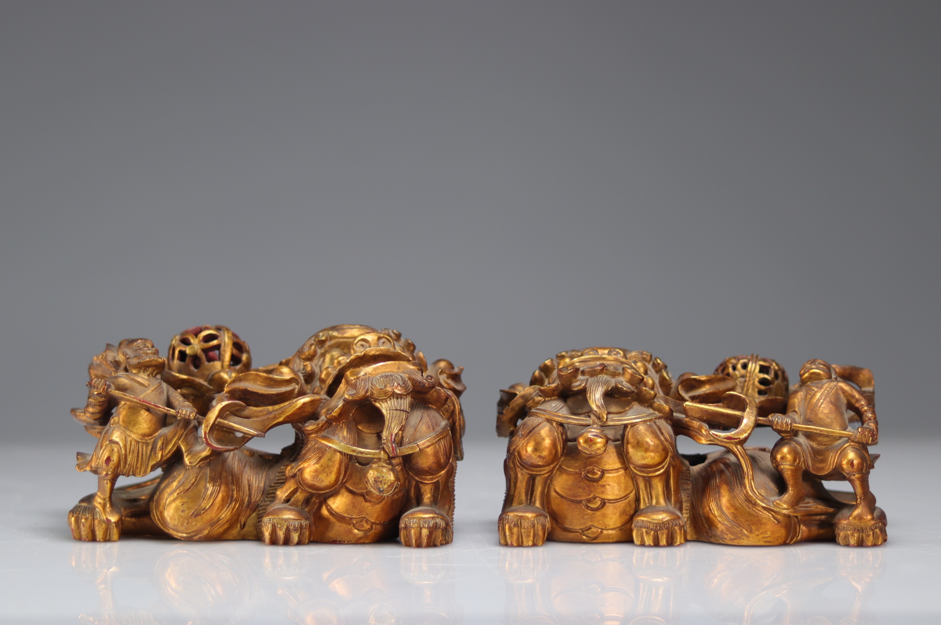 Fo dogs in carved and gilded wood, Qing period