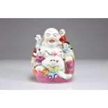 Buddha and children in famille rose porcelain