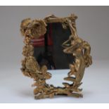 Art Nouveau bronze mirror decorated with a young woman and flowers