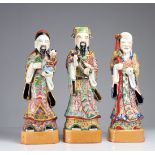 A set of three Chinese famille rose immortal figures, 19/20th C.
