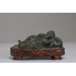 Qing period carved spinach jade reclining figure