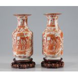 Pair of so-called Canton vases in porcelain and enamels of the rose family decorated in iron red and