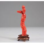 Young woman sculpted in red coral