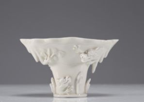 Libation cup in blanc de chine decorated with dragons Kangxi period