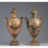 Imposing pair of marble and bronze cassolettes decorated with heads and flowers