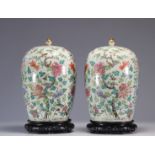 Pair of covered vases in famille rose porcelain with floral and bird decoration