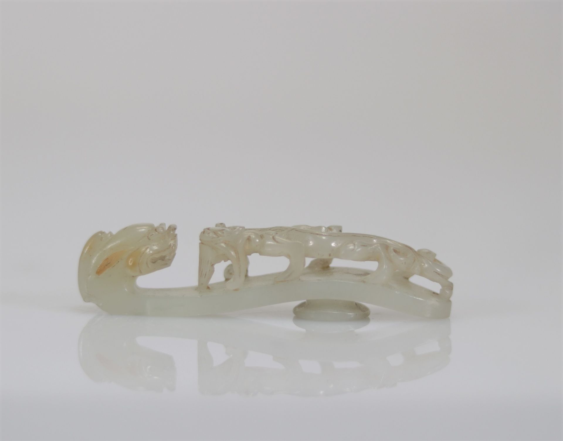 White jade fibula carved with a Qing period dragon and chilon