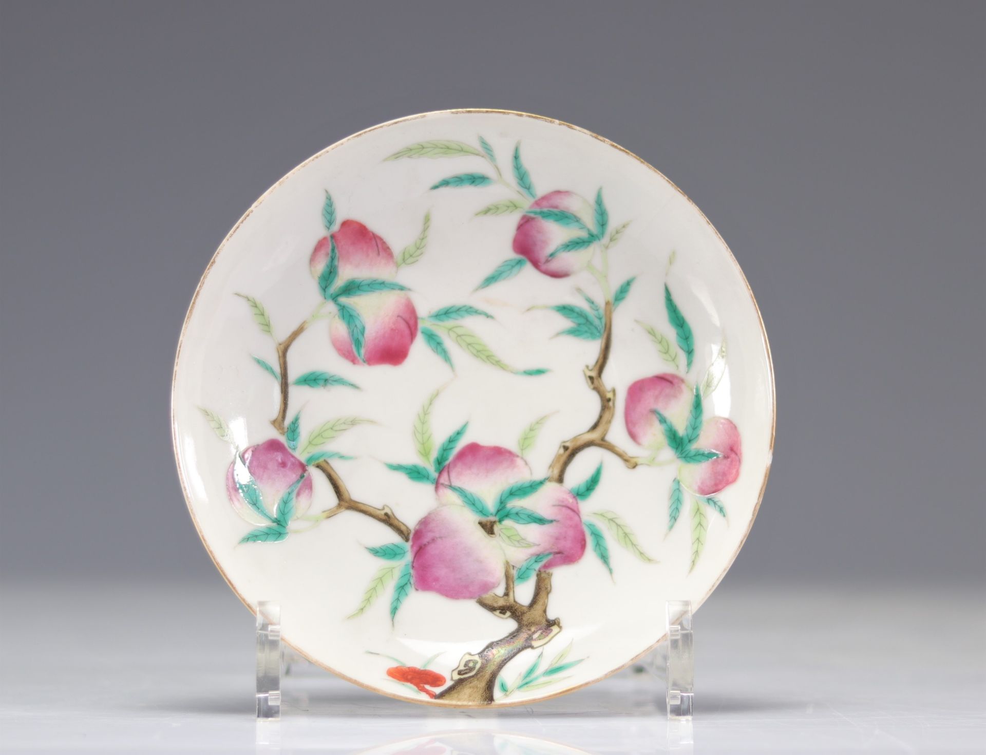 Small Chinese porcelain plate decorated with peaches