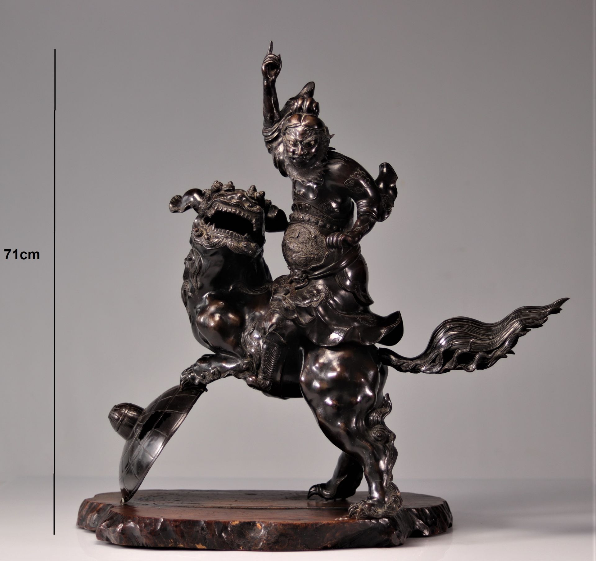 Imposing bronze warrior riding a Fo dog 19th century