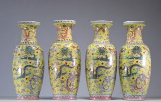 Vases (4) in Chinese famille rose porcelain decorated with dragons on a yellow background