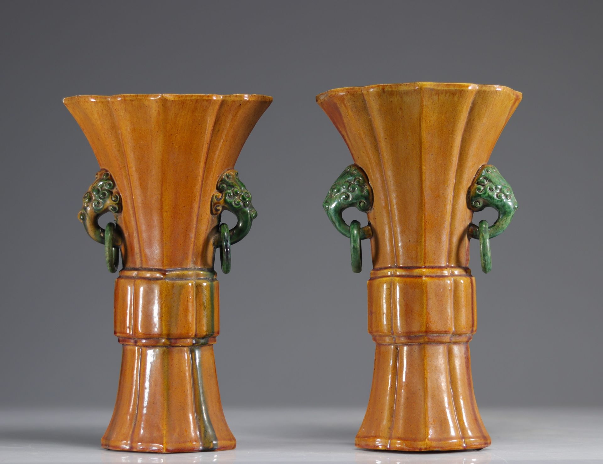 Pair of Gu-shaped Sancai porcelain and enamel vases