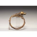 Indonesian work, semi-rigid gold bracelet decorated with a dragon, 19th C.